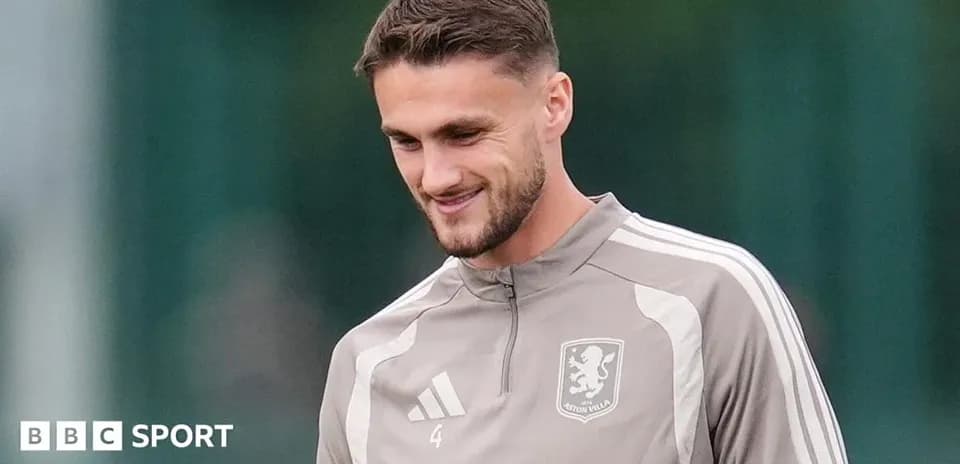 Player in Aston Villa training gear smiling