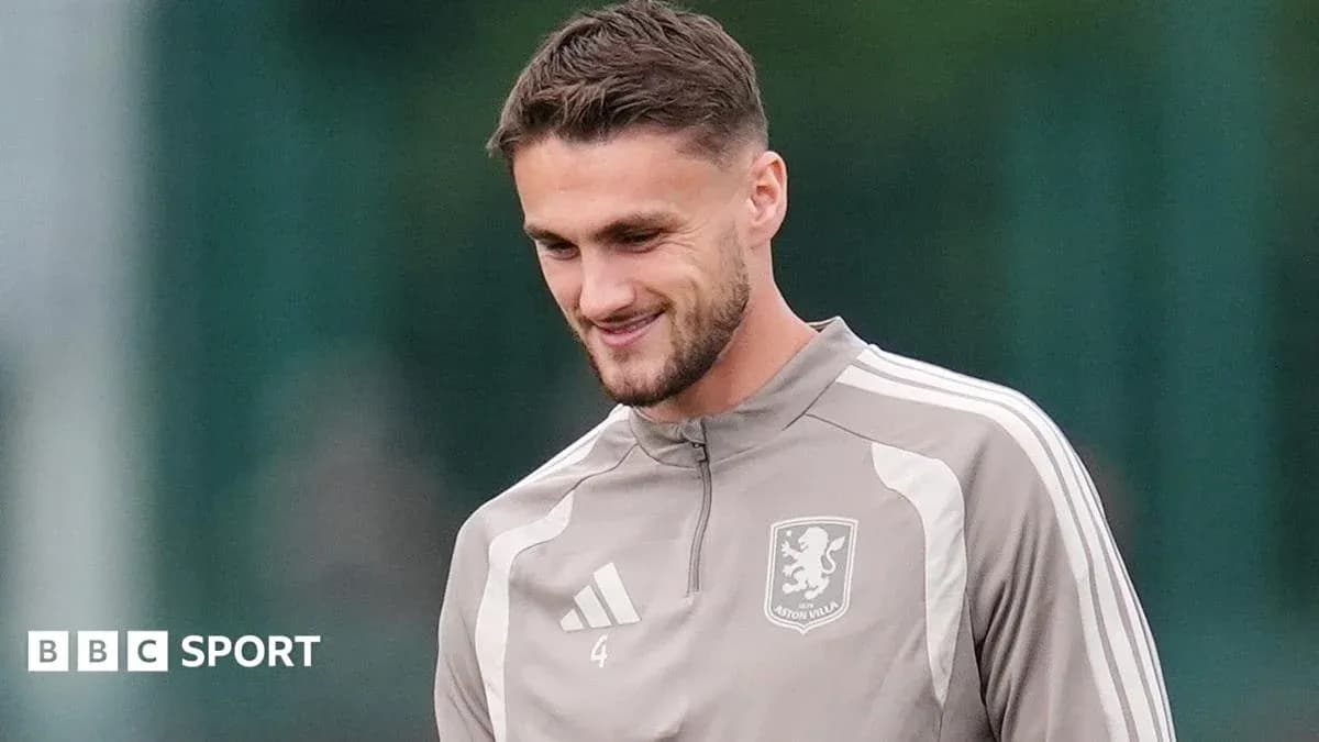 Player in Aston Villa training gear smiling