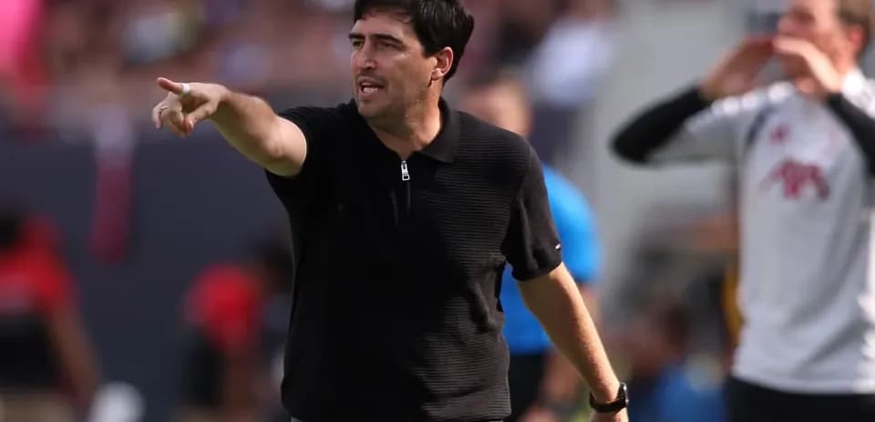 Coach directing players during a match
