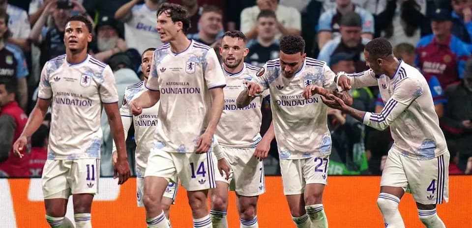 Aston Villa players celebrating a goal together