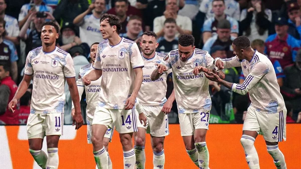 Aston Villa players celebrating a goal together