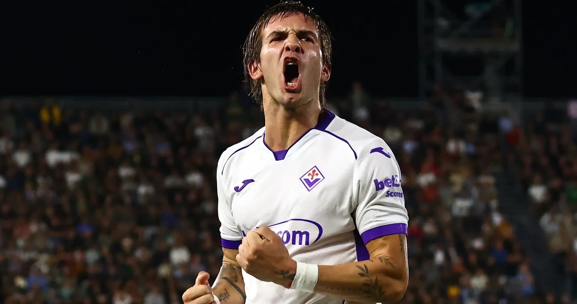 Fiorentina player celebrating a goal in match