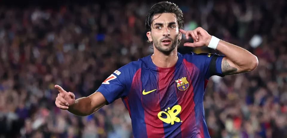 Player celebrating a goal at Camp Nou stadium
