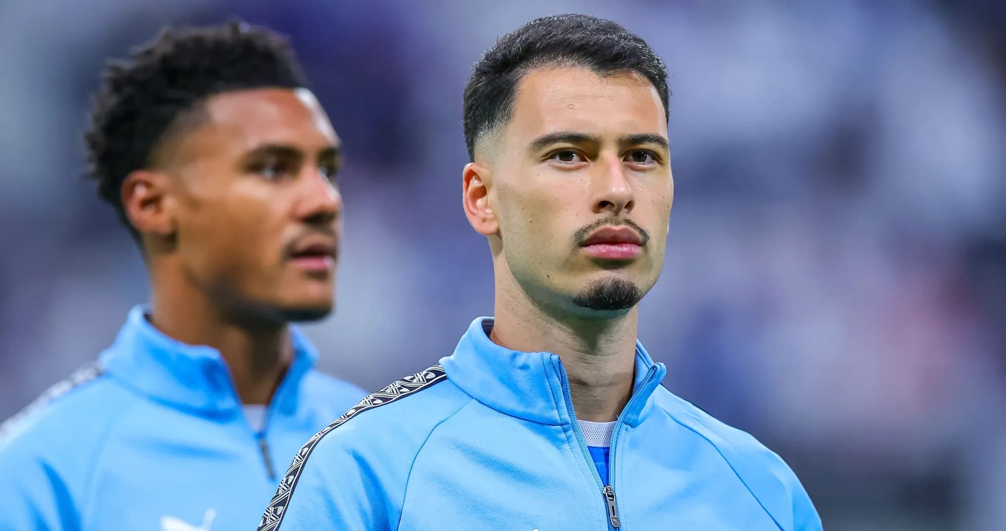 Two players in Marseille training gear before match