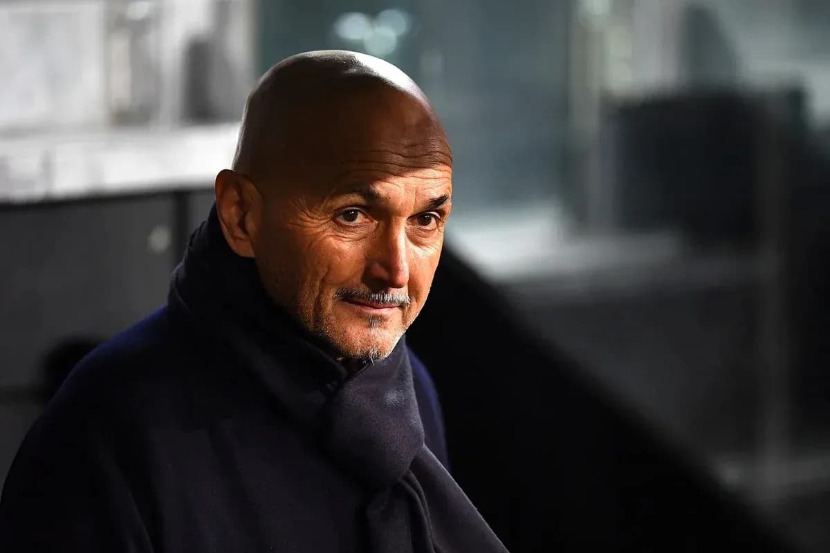 Coach wearing a dark scarf in stadium