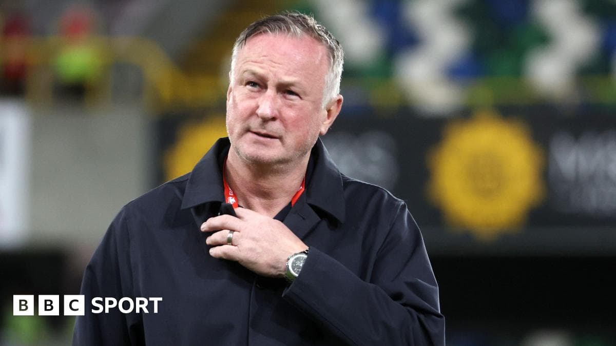 Football manager on pitch during match preparations