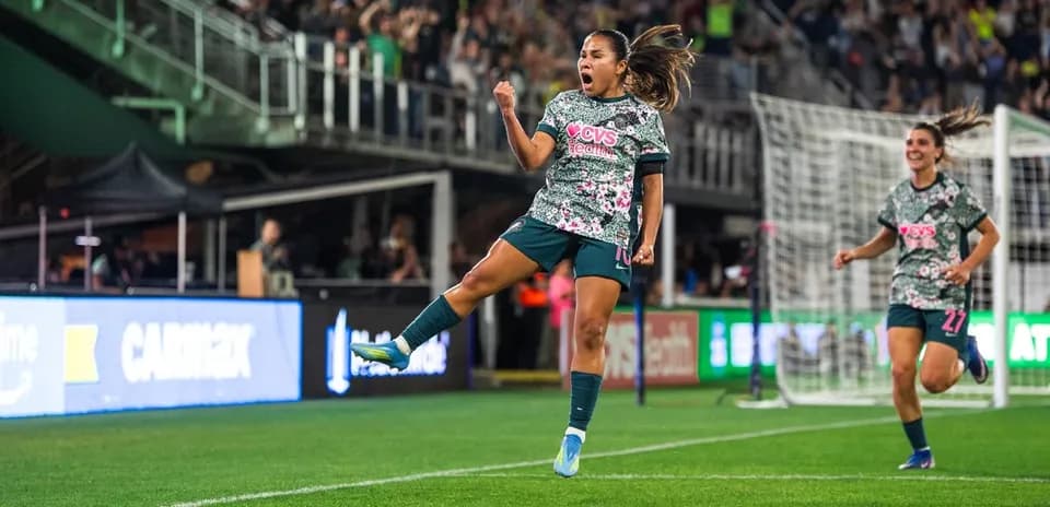 Player celebrating goal during NWSL match