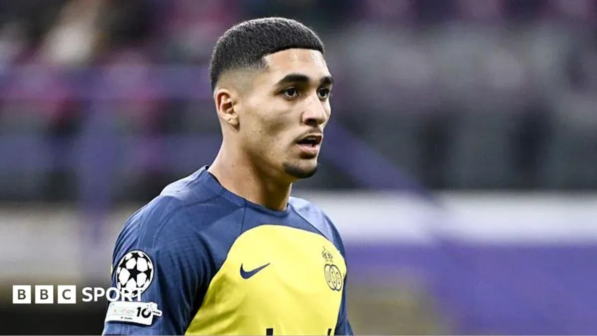 Player in training kit during match warm-up