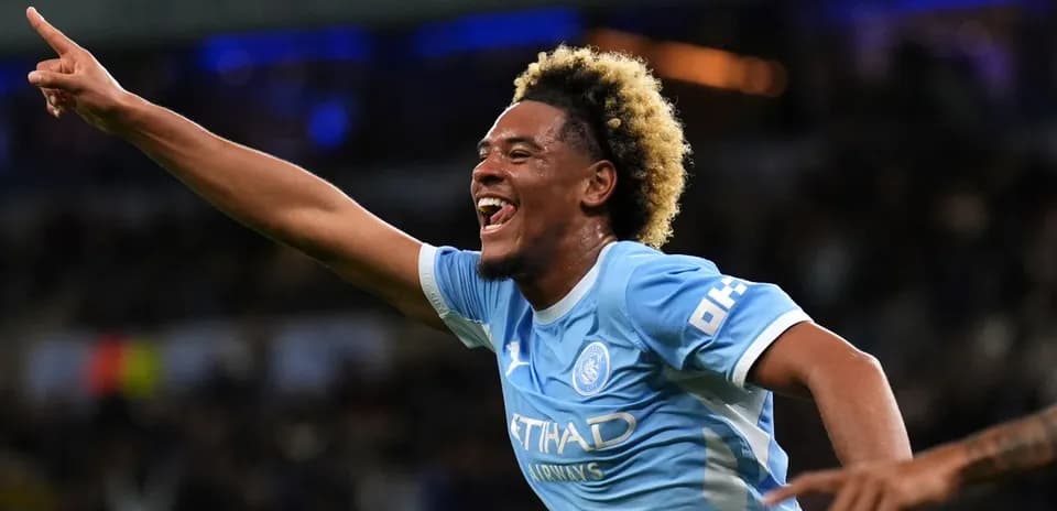 Player celebrating a goal in Manchester City jersey