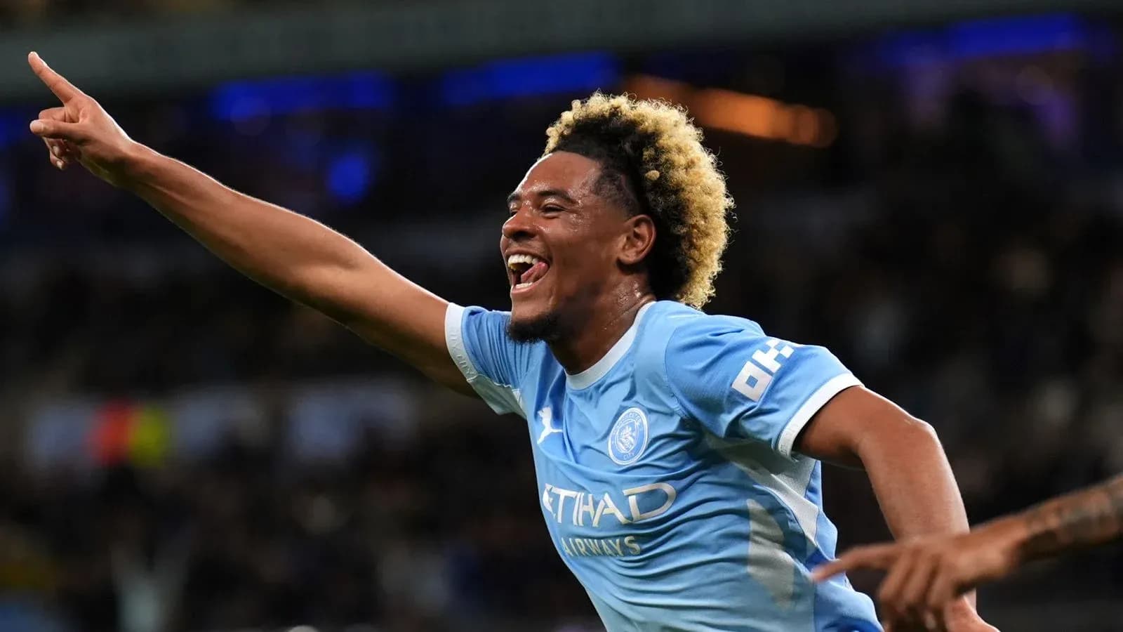 Player celebrating a goal in Manchester City jersey