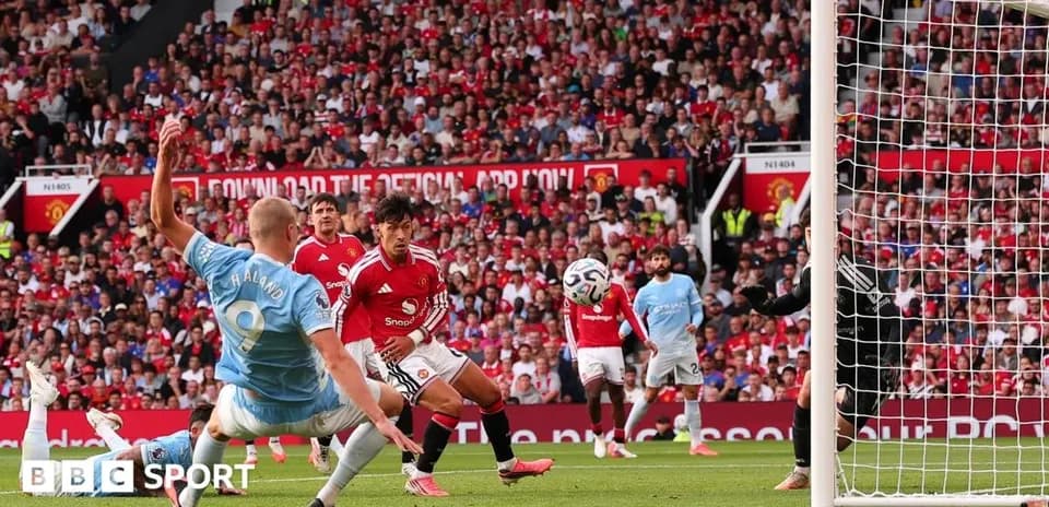 Players contesting a shot on goal during match