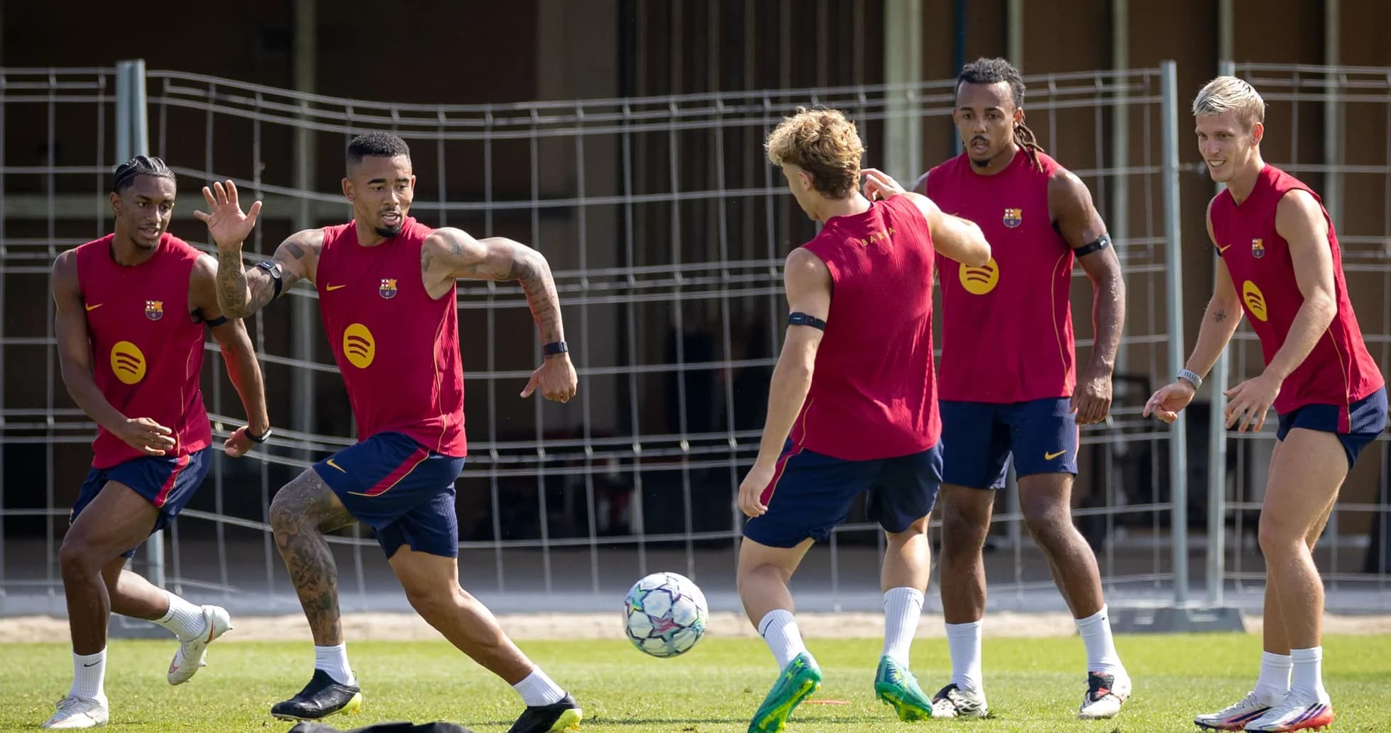 Barcelona players training and passing a soccer ball