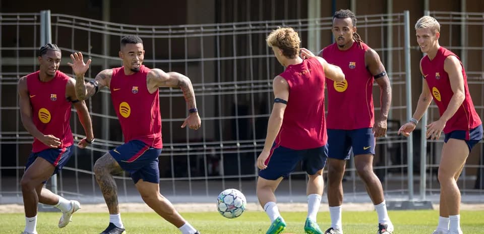Barcelona players training and passing a soccer ball