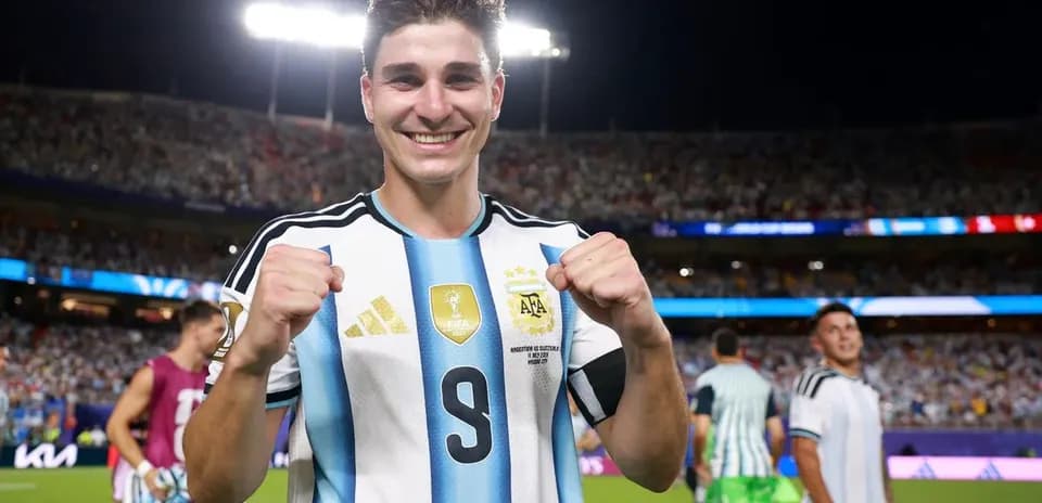 Player celebrating with clenched fists in stadium