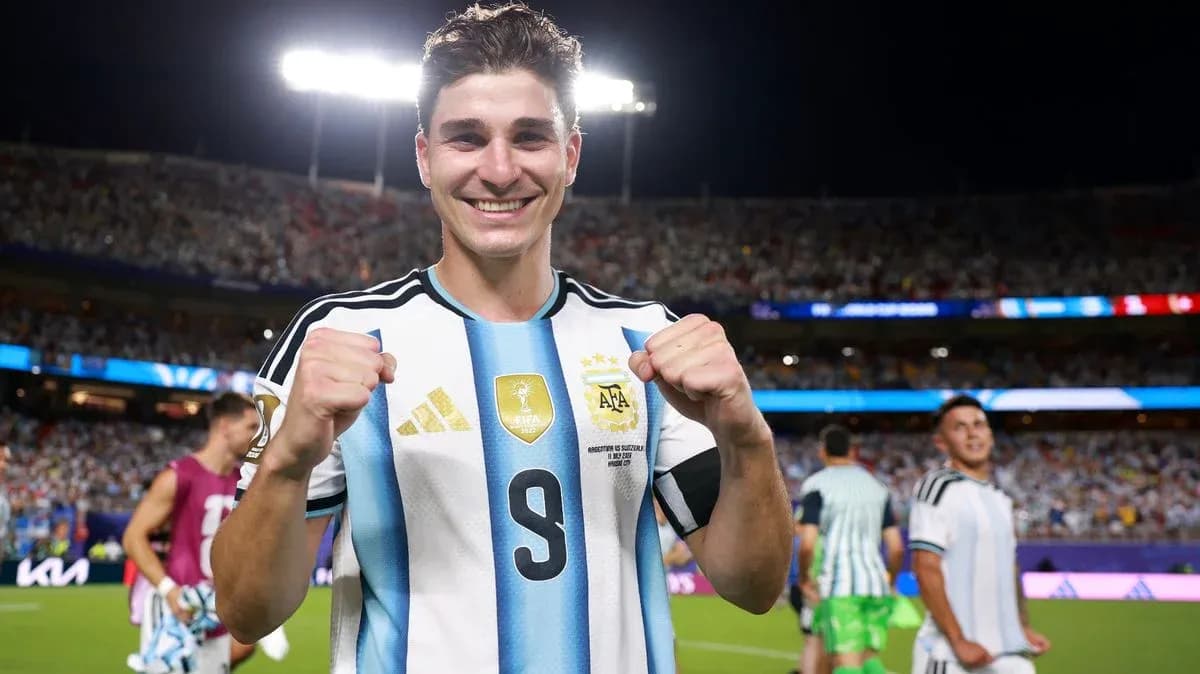 Player celebrating with clenched fists in stadium