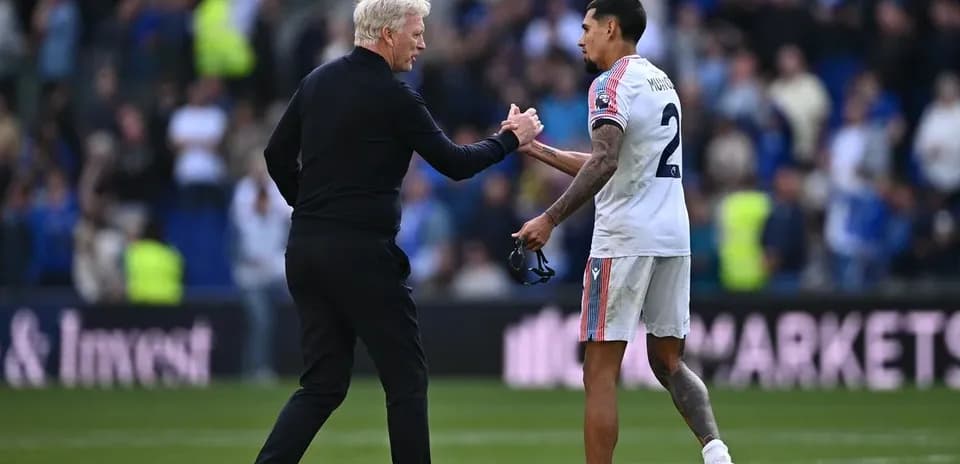 Coach and player shaking hands after match