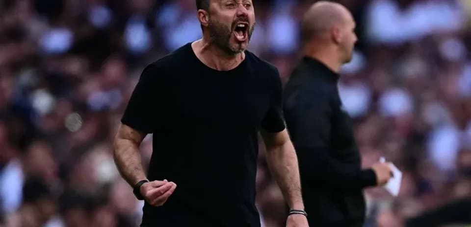 Coach celebrating passionately on the sideline