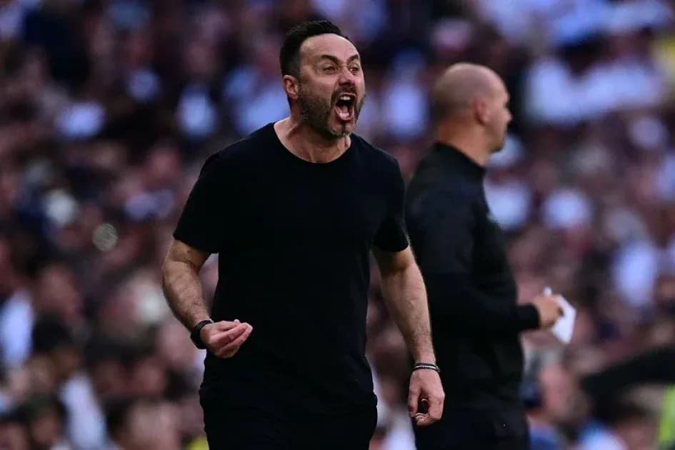 Coach celebrating passionately on the sideline