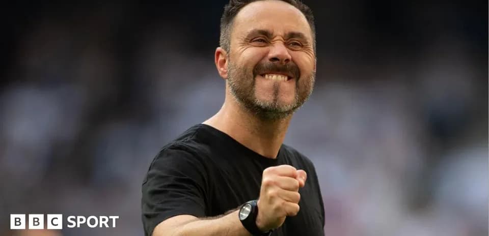 Coach celebrating with clenched fist during match