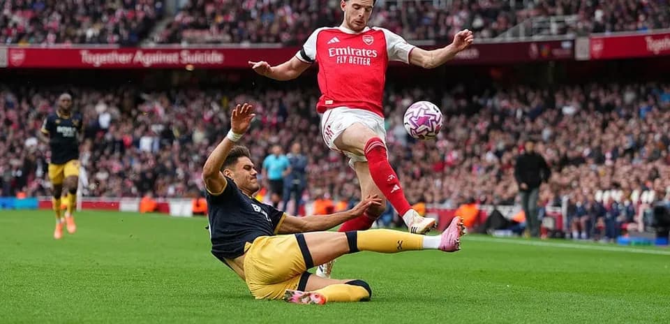 Player sliding tackle during West Ham vs Arsenal match