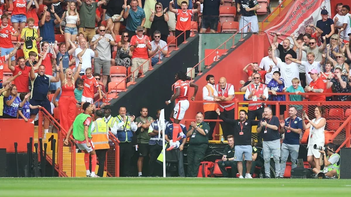 Fans celebrating a goal during a match