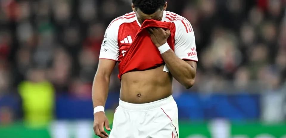 Player holding jersey to face during match