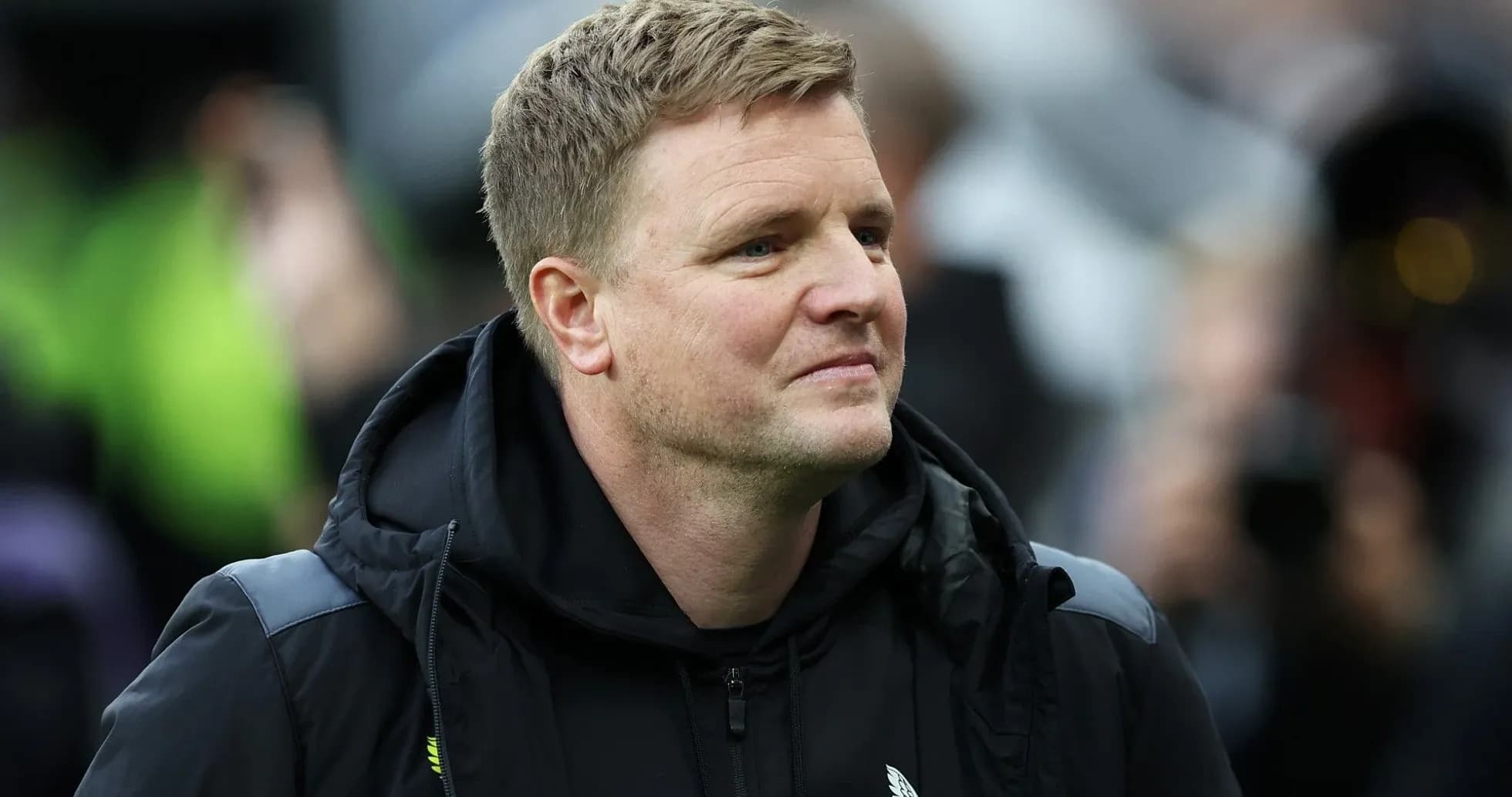 Coach observing from the sidelines during a match