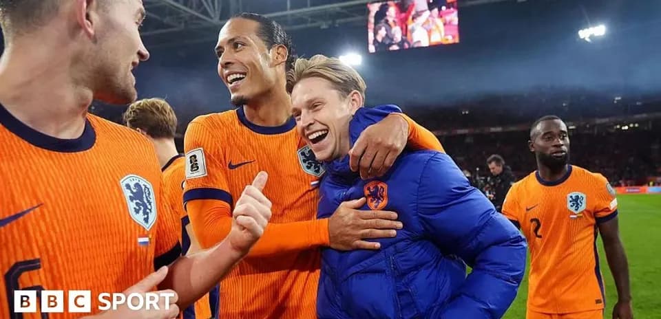 Dutch players celebrating on the pitch after match