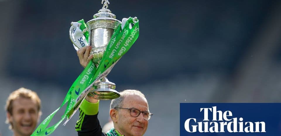 Manager holding trophy with celebration ribbons