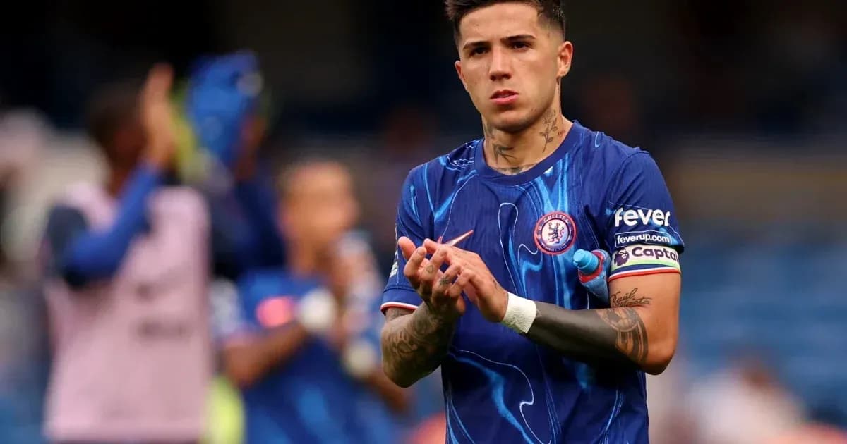 Player clapping in Chelsea kit during match