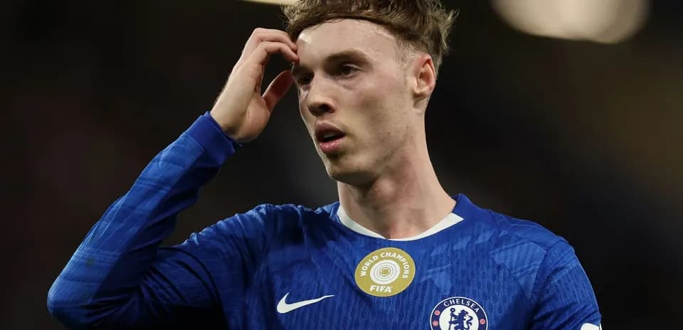 Chelsea player touching his head in confusion