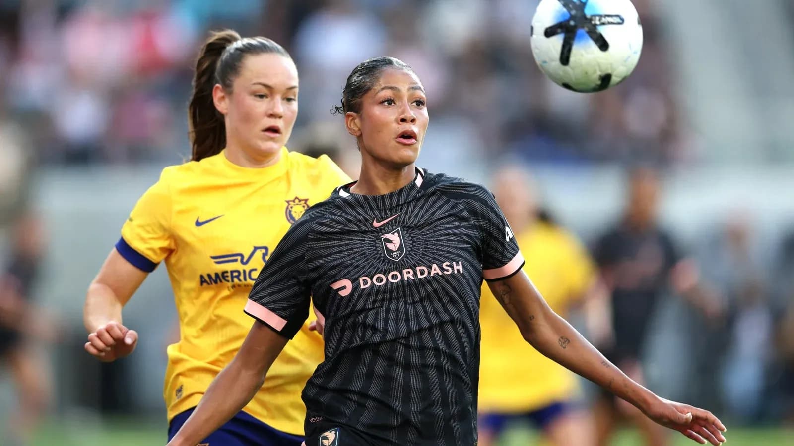 Angel City player controlling the ball during match