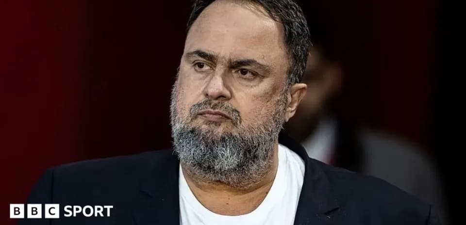 Man with beard wearing a black blazer