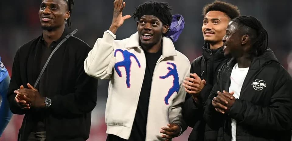 Four players celebrating during event on field