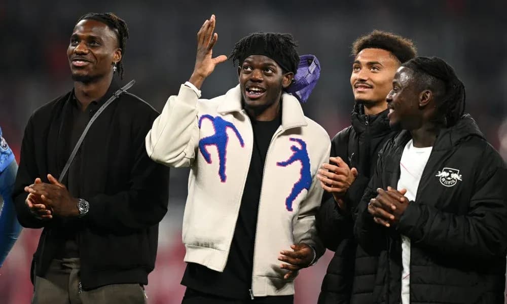 Four players celebrating during event on field