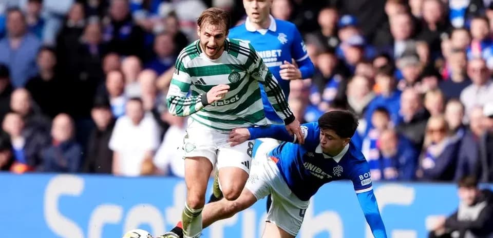 Celtic player evading a tackle during match