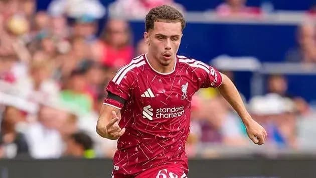 Liverpool player running with the ball during match