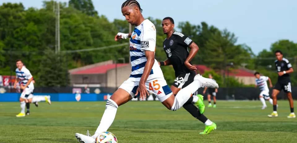 Player shooting the ball during Huntsville City match