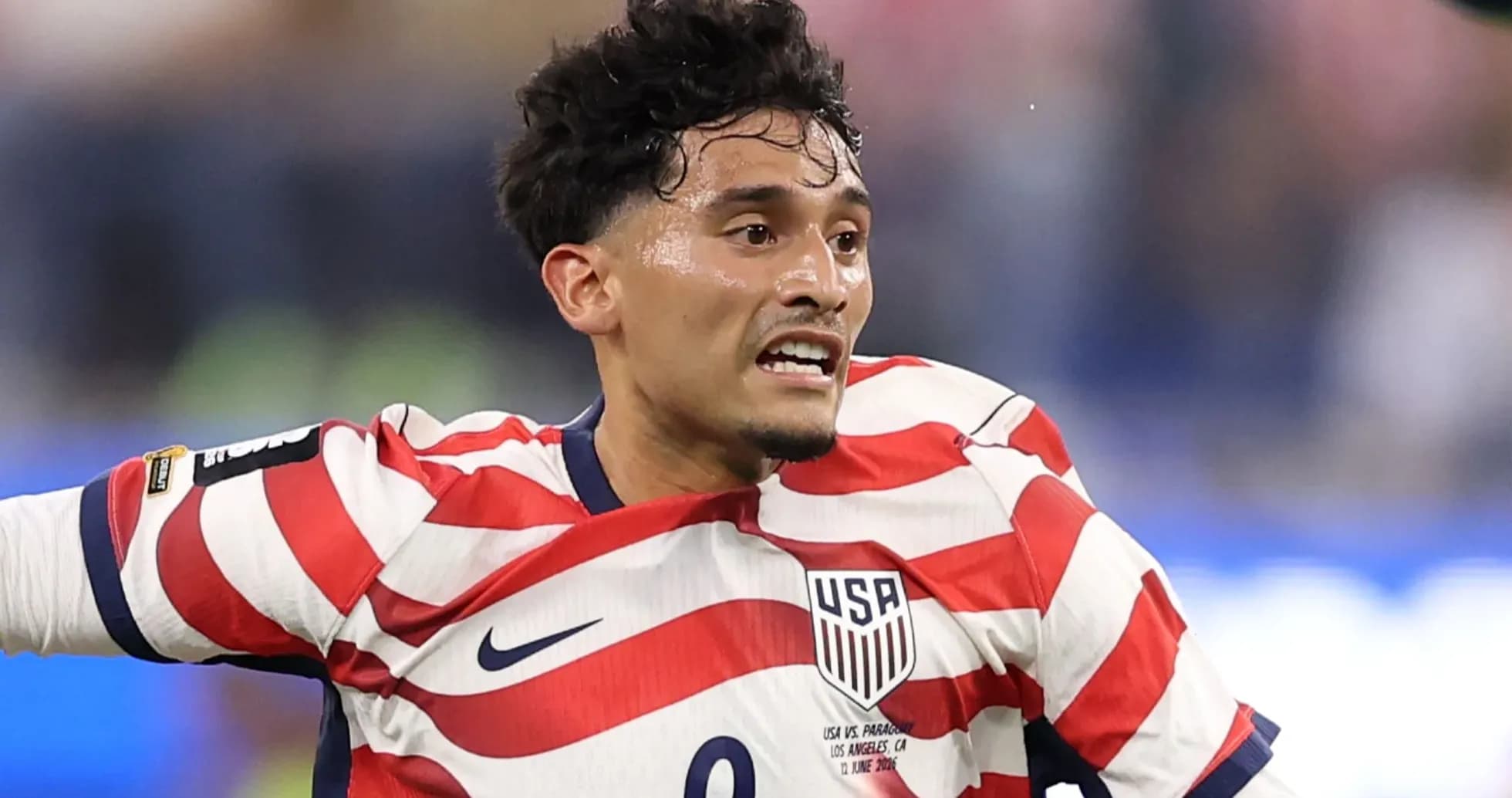 Player in USA jersey during soccer match