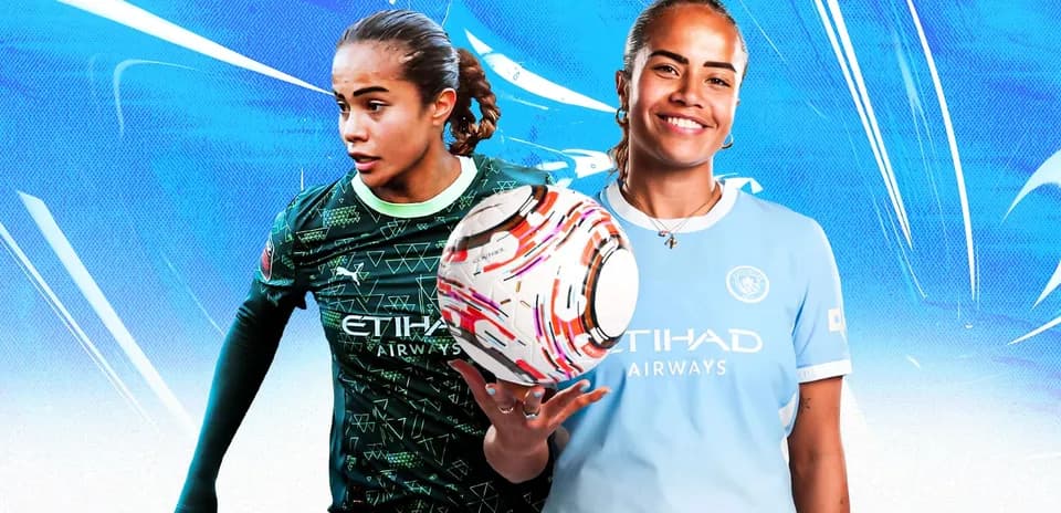 Two female soccer players wearing Manchester City kits
