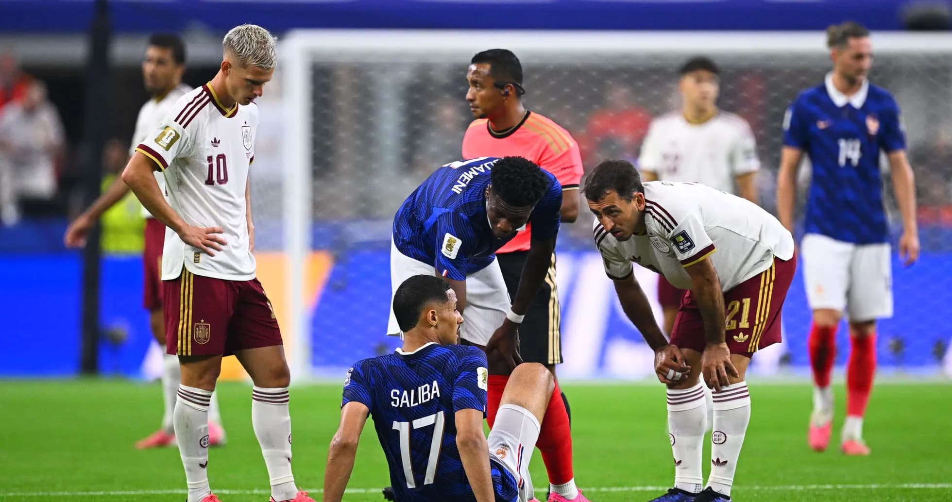 Players attending to injured teammate on field