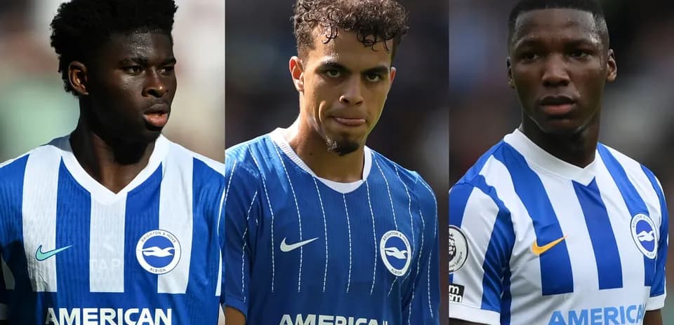 Three Brighton players in blue jerseys on field