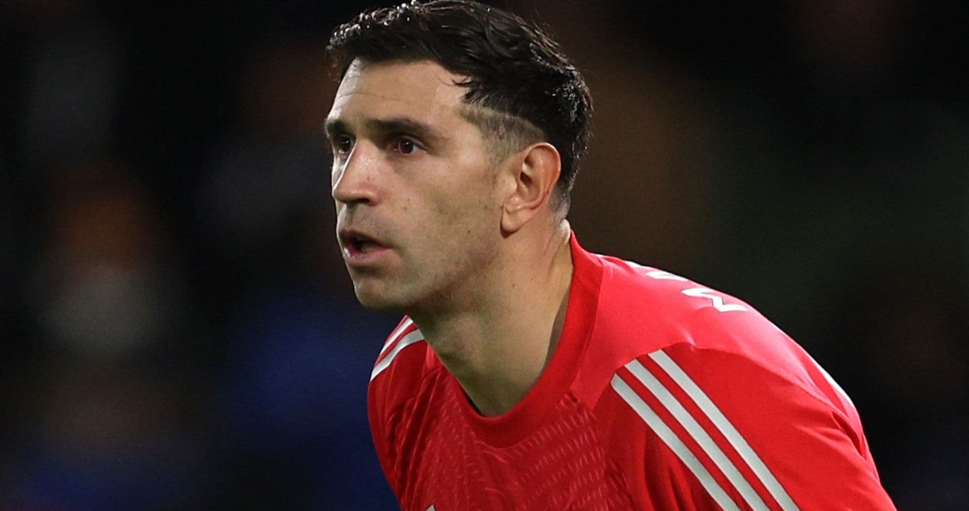 Goalkeeper in red kit during a match