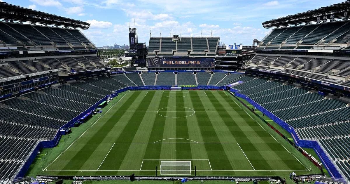 Empty soccer stadium with field and seating areas