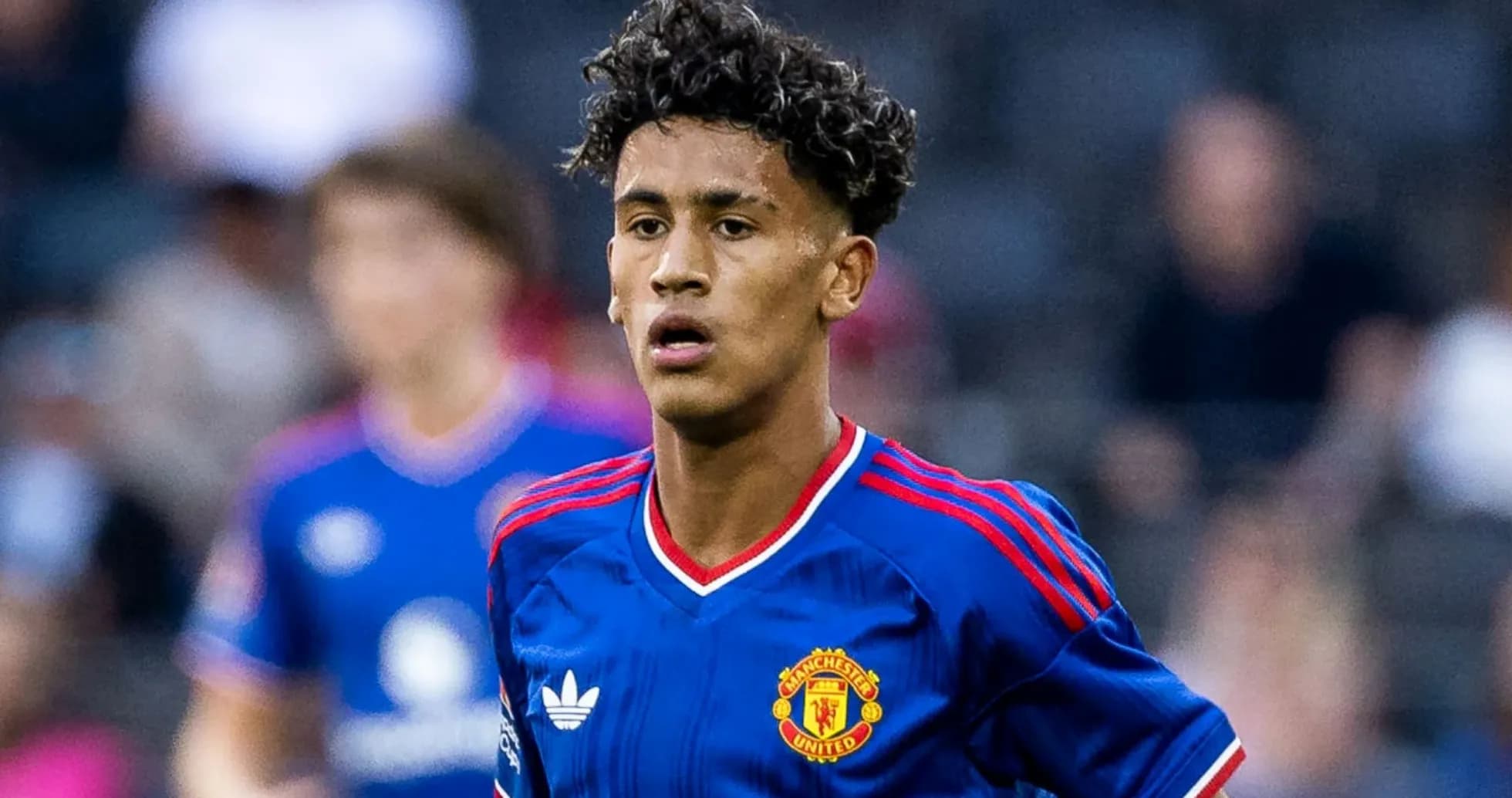 Young player in Manchester United jersey during match