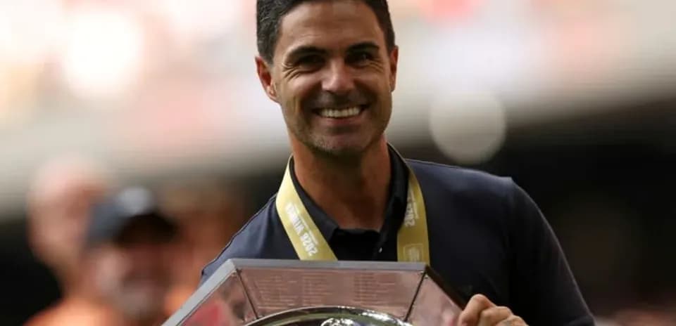 Manager holding trophy during celebration event