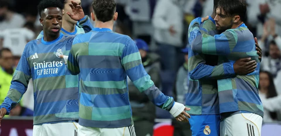 Real Madrid players embracing during warm-up session