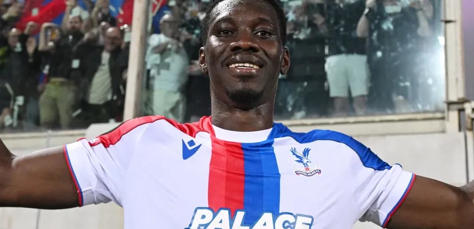 Player celebrating in Crystal Palace jersey after match