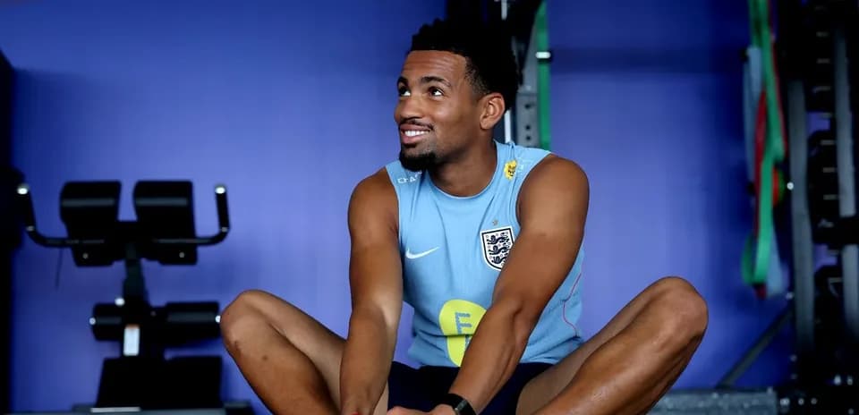Player stretching in gym during training session