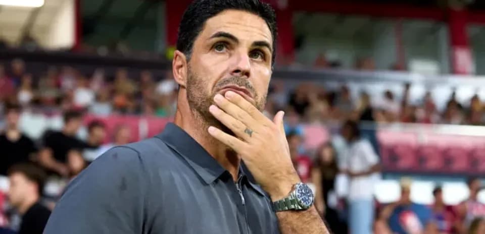 Manager observing the match with fans in background